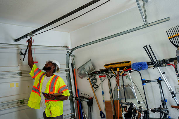 Professional Garage Door Panel Replacement technician working in Highland Park, MI